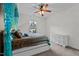 Bedroom with a canopy bed, a ceiling fan, and natural light from the window at 7709 Moondance Ct, Wake Forest, NC 27587