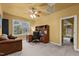 Bedroom with large window and comfortable sofa and desk setup for an office at 7709 Moondance Ct, Wake Forest, NC 27587