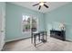 Bedroom features a large window with a view and black desk and dresser at 7709 Moondance Ct, Wake Forest, NC 27587