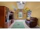 Upstairs bonus room featuring television, chair, and football theme at 7709 Moondance Ct, Wake Forest, NC 27587