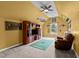 Bonus room features a TV, chair, and a ceiling fan at 7709 Moondance Ct, Wake Forest, NC 27587