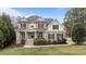 Charming two-story home with stone accents, a welcoming front porch, and professionally landscaped yard at 7709 Moondance Ct, Wake Forest, NC 27587