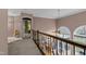 Second story foyer with railing overlooking the entry way at 7709 Moondance Ct, Wake Forest, NC 27587
