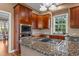 Updated kitchen featuring granite countertops, stainless steel appliances, and gas cooktop at 7709 Moondance Ct, Wake Forest, NC 27587