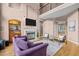 Upstairs view of great room with fireplace, TV, and cozy seating area at 7709 Moondance Ct, Wake Forest, NC 27587
