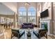 Spacious living room boasts soaring ceilings, large arched windows, fireplace, and stylish furnishings at 7709 Moondance Ct, Wake Forest, NC 27587
