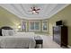 Main bedroom with three windows and a television at 7709 Moondance Ct, Wake Forest, NC 27587