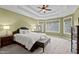 Main bedroom with tray ceiling and three windows at 7709 Moondance Ct, Wake Forest, NC 27587