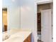 Bathroom featuring a wooden vanity with a white countertop and an open door to the toilet and shower at 9041 Chelsea Dr, Raleigh, NC 27603