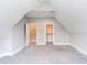 Bonus room features 2 doorways, neutral walls and gray carpet at 9041 Chelsea Dr, Raleigh, NC 27603