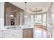Bright kitchen with stainless steel appliances, marble countertop, and view of the fireplace at 9041 Chelsea Dr, Raleigh, NC 27603