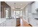 Bright kitchen with stainless steel appliances, marble countertop and breakfast nook with large windows at 9041 Chelsea Dr, Raleigh, NC 27603