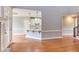 Open living room featuring a partial view of a kitchen with granite counters at 9041 Chelsea Dr, Raleigh, NC 27603