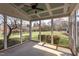 View from the screened in porch to a landscaped backyard with a playground at 9041 Chelsea Dr, Raleigh, NC 27603