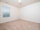 Inviting bedroom with neutral walls, neutral carpet, window with blinds, and base trim at 932 Peninsula Pl, Knightdale, NC 27545