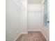 Walk-in closet provides ample storage with shelving and carpeted floor at 932 Peninsula Pl, Knightdale, NC 27545