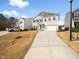 Charming two-story home with a well-manicured lawn and a two-car garage at 932 Peninsula Pl, Knightdale, NC 27545