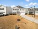 Charming two-story home with a well-manicured lawn and a two-car garage at 932 Peninsula Pl, Knightdale, NC 27545