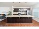 Spacious kitchen with granite countertops, stainless steel appliances, and dark wood cabinetry at 932 Peninsula Pl, Knightdale, NC 27545