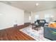Cozy living room with hardwood floors, comfortable seating, and lots of natural light at 932 Peninsula Pl, Knightdale, NC 27545