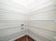 Corner pantry featuring light walls, laminate floors, and bright white wire shelving at 932 Peninsula Pl, Knightdale, NC 27545