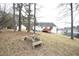Spacious backyard with stone seating area and ample room for outdoor activities and relaxation at 104 Hickory Glen Ln, Durham, NC 27703