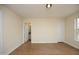 Spacious bedroom features light walls, wood-look flooring, and access to a bathroom at 104 Hickory Glen Ln, Durham, NC 27703