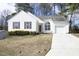 Charming one-story home with white siding, brown shutters, and a well-manicured front yard at 104 Hickory Glen Ln, Durham, NC 27703