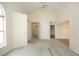 Spacious living room with neutral walls, patterned carpet, and multiple entryways at 104 Hickory Glen Ln, Durham, NC 27703
