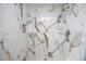 Beautiful marble-look tile shower with a rainfall showerhead at 104 Hickory Glen Ln, Durham, NC 27703