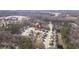Aerial view pinpointing a home within a verdant residential community, showcasing location and surroundings at 105 Palladium Ct, Elon, NC 27244