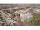 An aerial shot of houses in a wooded neighborhood, revealing proximity to nature and community living at 105 Palladium Ct, Elon, NC 27244