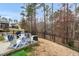 Relaxing backyard patio with outdoor seating, grill, and fire pit, perfect for entertaining at 105 Palladium Ct, Elon, NC 27244