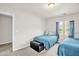Bedroom featuring two twin beds and neutral walls and carpet at 105 Palladium Ct, Elon, NC 27244