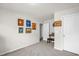 Bright bedroom with neutral walls and carpet and various colorful art pieces at 105 Palladium Ct, Elon, NC 27244