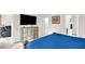 View of the main bedroom featuring TV, storage unit, and ensuite bath at 105 Palladium Ct, Elon, NC 27244