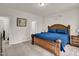 Inviting main bedroom with a decorative bed, ensuite bathroom, and plush carpeting at 105 Palladium Ct, Elon, NC 27244