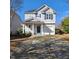 Charming two-story home with a well-manicured front yard and a cozy entrance at 108 Palmdale Ct, Holly Springs, NC 27540