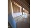 Unfinished attic space shows exposed rafters and plywood sheathing, ready for customization into a functional living area at 108 Pointe Park Cir, Holly Springs, NC 27540