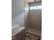 Tiled shower stall is displayed in the bathroom, complete with a small window for natural light at 108 Pointe Park Cir, Holly Springs, NC 27540