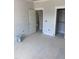 A light color bedroom with an open closet and an open door to the stairway at 108 Pointe Park Cir, Holly Springs, NC 27540