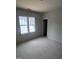 A bedroom with a window brings natural light to the space, promoting a serene atmosphere at 108 Pointe Park Cir, Holly Springs, NC 27540