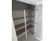 A closet with multiple shelves is an ideal storage for clothes and accessories at 108 Pointe Park Cir, Holly Springs, NC 27540