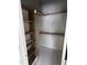 An organized closet with shelves maximizes storage capacity, keeping belongings neatly arranged at 108 Pointe Park Cir, Holly Springs, NC 27540