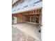Spacious unfinished garage with exposed framing and plenty of room for multiple cars at 108 Pointe Park Cir, Holly Springs, NC 27540