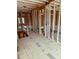 Home interior showing framing, exposed beams, and future staircase structure at 108 Pointe Park Cir, Holly Springs, NC 27540