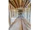 Interior view showing home's wooden framework, future staircase, and visible ceiling beams at 108 Pointe Park Cir, Holly Springs, NC 27540