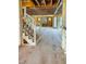 Interior view featuring wooden framing, staircase framework, and door to the outdoors at 108 Pointe Park Cir, Holly Springs, NC 27540