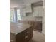 Spacious kitchen featuring bright white cabinets and stainless steel appliances at 108 Pointe Park Cir, Holly Springs, NC 27540