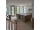 Spacious kitchen with stainless steel appliances and door to outdoor patio at 108 Pointe Park Cir, Holly Springs, NC 27540